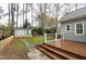 Backyard view showing a small shed, wooden deck, and grass at 1821 Kelly Glen Dr, Apex, NC 27502