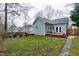 A well-manicured lawn with a landscaped garden and home in the background at 1821 Kelly Glen Dr, Apex, NC 27502