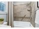 Close-up of bathroom shower-tub combination, showcasing the tiled surround and accessibility features at 1821 Kelly Glen Dr, Apex, NC 27502