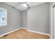 Bedroom featuring hardwood floors, natural light from the window, and a ceiling fan at 1821 Kelly Glen Dr, Apex, NC 27502