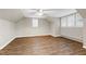 Large bedroom with hardwood floors and ample natural light from multiple windows at 1821 Kelly Glen Dr, Apex, NC 27502