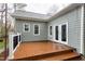 View of a backyard deck with railings and French doors leading into the home at 1821 Kelly Glen Dr, Apex, NC 27502