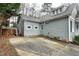 Side view of the home with light green siding and a concrete patio at 1821 Kelly Glen Dr, Apex, NC 27502
