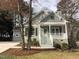 Charming two-story home featuring a inviting front porch and freshly landscaped yard at 1821 Kelly Glen Dr, Apex, NC 27502