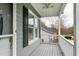 View of covered porch with ceiling fan, railings, and an outside view at 1821 Kelly Glen Dr, Apex, NC 27502