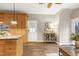 Open concept kitchen with dark wood flooring and cabinetry, offering plenty of storage at 1821 Kelly Glen Dr, Apex, NC 27502