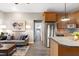 Open concept living room and kitchen area with hardwood floors and lots of natural light at 1821 Kelly Glen Dr, Apex, NC 27502