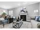 Bright living room showcasing a decorative fireplace and modern furniture at 1821 Kelly Glen Dr, Apex, NC 27502