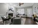 View of a well-decorated living room with fireplace and an exterior door at 1821 Kelly Glen Dr, Apex, NC 27502