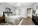 Spacious main bedroom featuring neutral tones, ceiling fan, closet with sliding doors, and modern decorations at 1821 Kelly Glen Dr, Apex, NC 27502