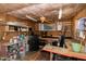 Shed interior featuring storage shelves, work bench and a ceiling fan at 1821 Kelly Glen Dr, Apex, NC 27502