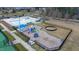 An aerial view of the community pool and playground area, complete with slides and tennis court at 1913 Brodgen Ln, Durham, NC 27703