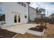 This home features a concrete back patio with raised garden beds and mature landscaping at 1913 Brodgen Ln, Durham, NC 27703