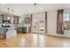 This kitchen has stainless appliances, gray cabinets, hardwood floors, and access to the backyard at 1913 Brodgen Ln, Durham, NC 27703