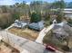 Aerial view of the home with mature trees, driveway, and neighborhood surroundings at 1917 Bivins St, Durham, NC 27707