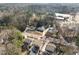Aerial view of neighborhood with houses, mature trees, and street at 1917 Bivins St, Durham, NC 27707