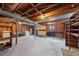Exposed basement with brick walls and exposed rafters, offering plenty of storage space at 1917 Bivins St, Durham, NC 27707