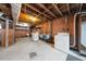 Unfinished basement with laundry area and storage at 1917 Bivins St, Durham, NC 27707
