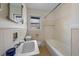Traditional bathroom with neutral tile, white fixtures, and built in shower at 1917 Bivins St, Durham, NC 27707