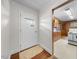 Bright entryway featuring a front door with modern windows and a glimpse of the adjacent kitchen at 1917 Bivins St, Durham, NC 27707