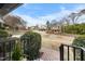 A view of neighborhood homes framed by lush greenery and landscaping at 1917 Bivins St, Durham, NC 27707