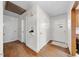 Hallway featuring hardwood floors, fresh paint and a partial view of the front door at 1917 Bivins St, Durham, NC 27707