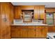 Classic kitchen featuring wood cabinets, natural light, and ample counter space at 1917 Bivins St, Durham, NC 27707