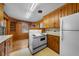 Bright kitchen with classic appliances, hardwood flooring, and ample cabinet space at 1917 Bivins St, Durham, NC 27707