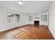 Bright living room with hardwood floors, brick fireplace and built-in shelving at 1917 Bivins St, Durham, NC 27707