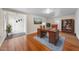 Bright home office with hardwood floors, a classic desk, and built in bookshelves at 1917 Bivins St, Durham, NC 27707