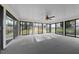 Sunroom with large windows offering natural light and scenic backyard views at 1917 Bivins St, Durham, NC 27707