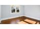 Bright empty room features gleaming hardwood floors and a window view at 2005 Glenwood Ave, Raleigh, NC 27608
