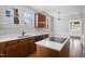 Kitchen featuring wooden cabinets, white countertops, stainless steel appliances, and natural lighting at 2005 Glenwood Ave, Raleigh, NC 27608