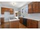 Bright kitchen featuring wooden cabinets, white countertops and stainless appliances at 2005 Glenwood Ave, Raleigh, NC 27608
