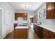 Well-lit kitchen with wood cabinets, stainless appliances, and modern countertops at 2005 Glenwood Ave, Raleigh, NC 27608