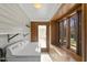 Bright laundry room features a modern washer and dryer, wood accents, and ample natural light through multiple windows at 2005 Glenwood Ave, Raleigh, NC 27608