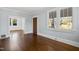 Light-filled living room boasting hardwood floors and classic architectural details at 2005 Glenwood Ave, Raleigh, NC 27608