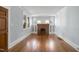 Charming living room with a brick fireplace, complemented by hardwood floors and ample natural light at 2005 Glenwood Ave, Raleigh, NC 27608
