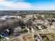 Aerial view of a residential neighborhood with houses surrounded by trees at 206 May Farm Rd, Pittsboro, NC 27312