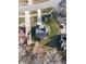 Overhead view of a home's backyard with a stone firepit and lush green lawn at 206 May Farm Rd, Pittsboro, NC 27312