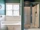 Bathroom featuring soaking tub, walk-in shower, and natural light at 206 May Farm Rd, Pittsboro, NC 27312