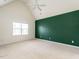 Large, light-filled bedroom featuring vaulted ceiling and neutral carpet at 206 May Farm Rd, Pittsboro, NC 27312