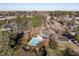 Aerial view showcasing the community pool surrounded by trees and parking at 206 May Farm Rd, Pittsboro, NC 27312