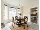 Cozy dining room featuring a round table, natural light, and hardwood floors at 206 May Farm Rd, Pittsboro, NC 27312