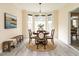 Charming dining room with wood table, modern light fixture, and stylish decor at 206 May Farm Rd, Pittsboro, NC 27312