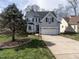 Charming two-story home with a well-manicured lawn and a two-car garage at 206 May Farm Rd, Pittsboro, NC 27312