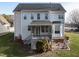Back exterior view featuring a deck, bay window, and manicured landscaping at 206 May Farm Rd, Pittsboro, NC 27312