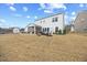 Expansive backyard has a fire pit, outdoor seating, shed, and room for activities at 213 Chateau Way, Angier, NC 27501