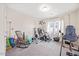 Versatile room with exercise equipment, carpeted floor, and natural light at 213 Chateau Way, Angier, NC 27501