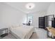 Well-lit bedroom featuring a bed, desk, and ample closet space for storage at 213 Chateau Way, Angier, NC 27501